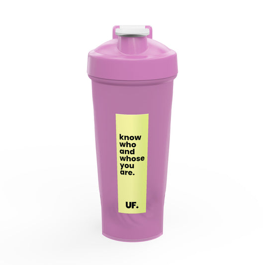 Pink shaker bottle with a yellow label on a white background